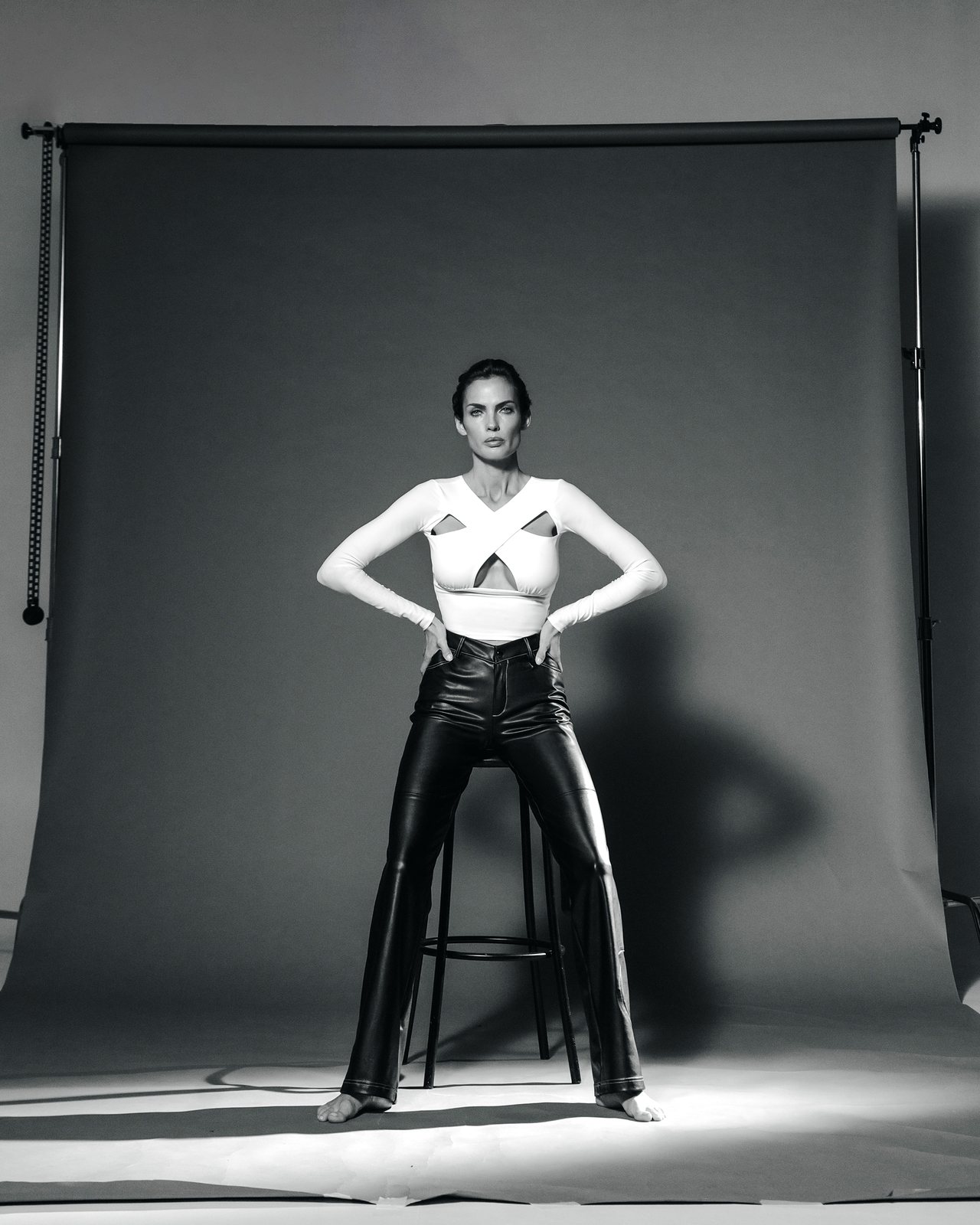 Natalia Boykova, full length studio, cut-out top and leather trousers
