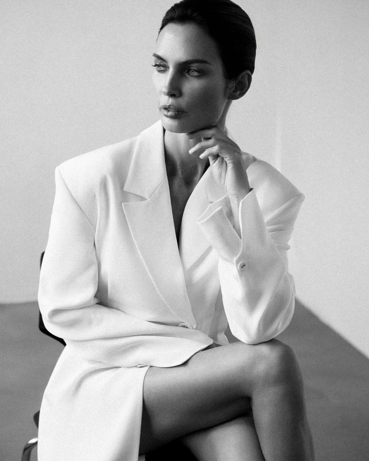 Natalia Boykova seated in a white blazer